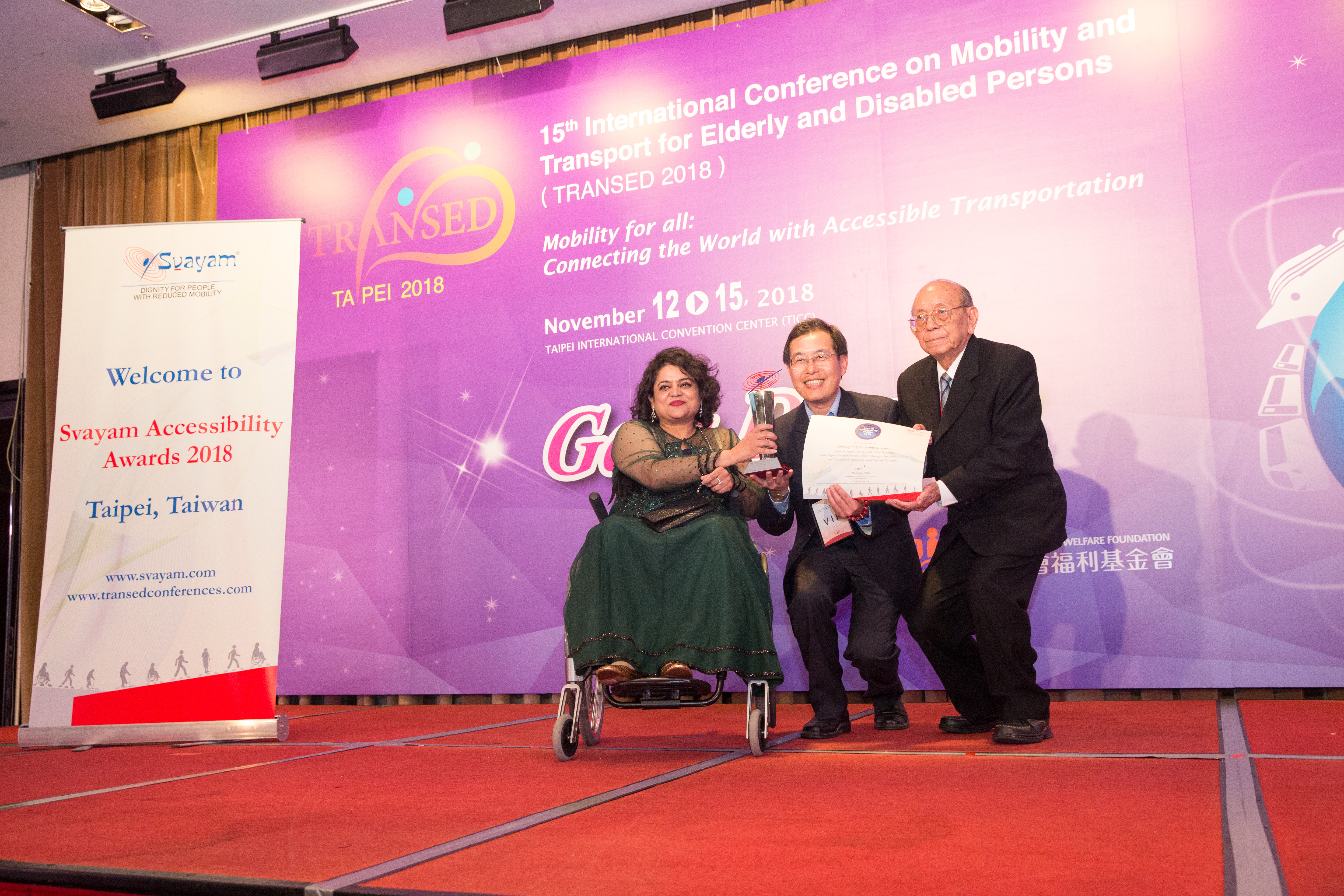 hoto of Mr. Hui-Sheng, Feng, Deputy Director, Transportation Bureau, Taichung City Government, Taiwan, receiving Svayam Accessibility Award 2018 from Svayam Founder Ms. Sminu Jindal & Mr. Patrick Yey, Hony. Chairman, TRANSED2018, at Taipei on 14 Nov 2018 on the sidelines of 15th International Conference on Mobility and Transport for Elderly and Disabled Persons (TRANSED2018)
